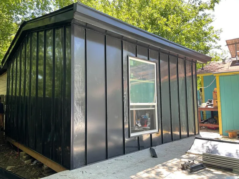 Black standing seam metal wall panels for Metal Roof Installation in Cibolo